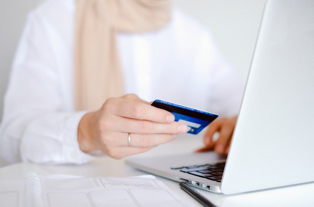 person paying online with a credit card